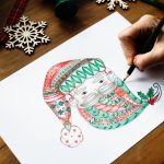 adult coloring a christmas picture