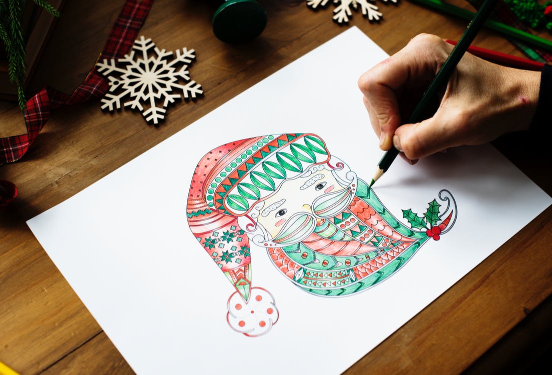 adult coloring a christmas picture